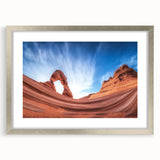 Landscape print of canyons framed in a sleek silver mat, showcasing vibrant earthy tones and intricate details, ideal for home decor and adding an artistic touch.