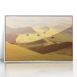 Framed acrylic artwork depicting a serene desert landscape with vibrant orange and yellow hues, set against a sleek white frame, perfect for modern home decor.