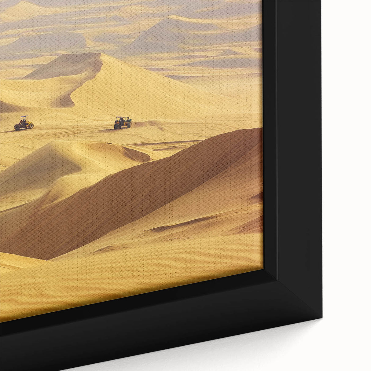 Close-up view of a framed canvas art piece showcasing a vibrant desert landscape with warm hues of orange and gold, perfect for enhancing home decor.