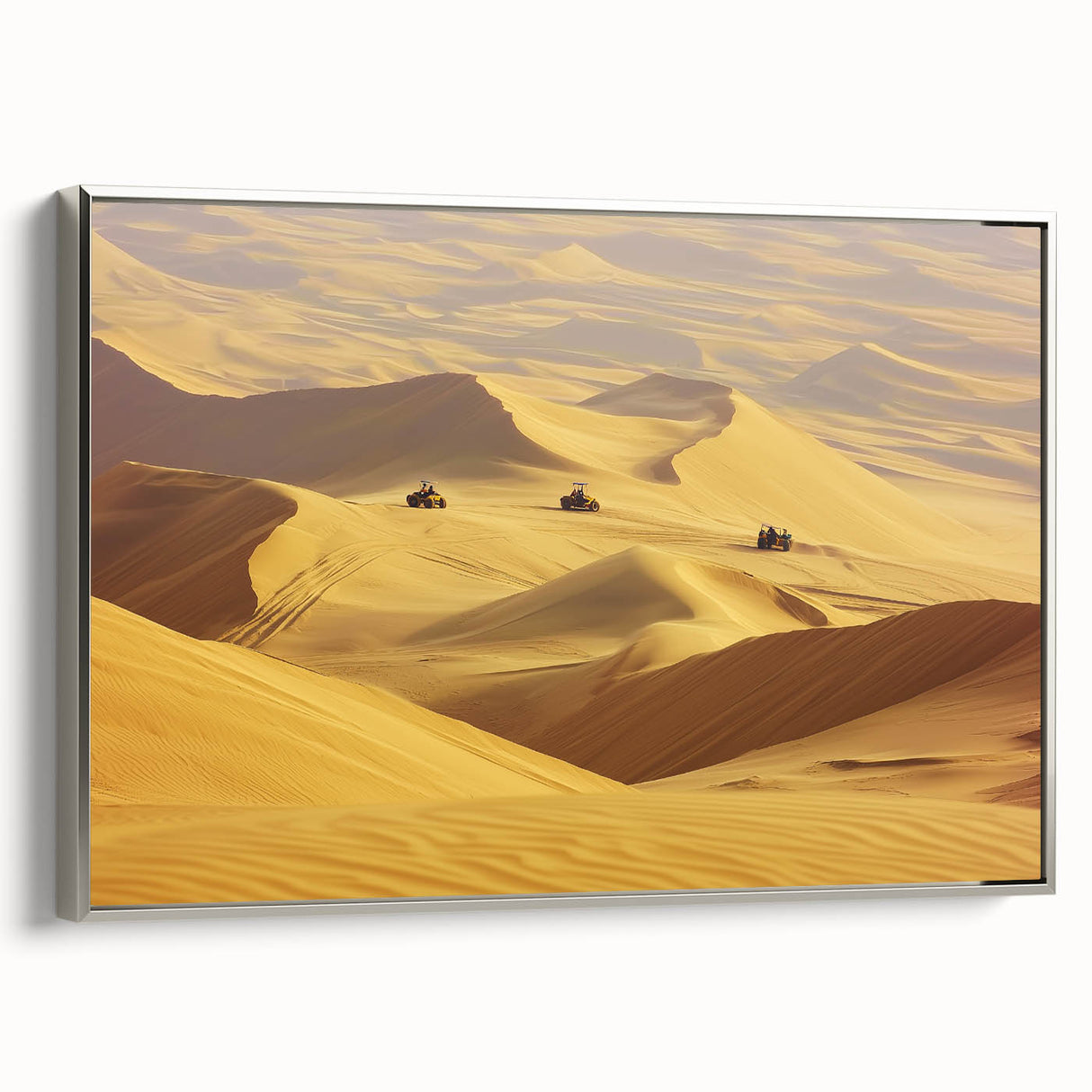 Framed canvas artwork of a desert landscape with a silver frame, showcasing warm tones of orange and brown, ideal for home decor and modern interiors.