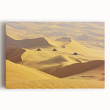Desert landscape stretched canvas art featuring warm hues of orange and yellow with dramatic rock formations and a clear blue sky, perfect for home decor.