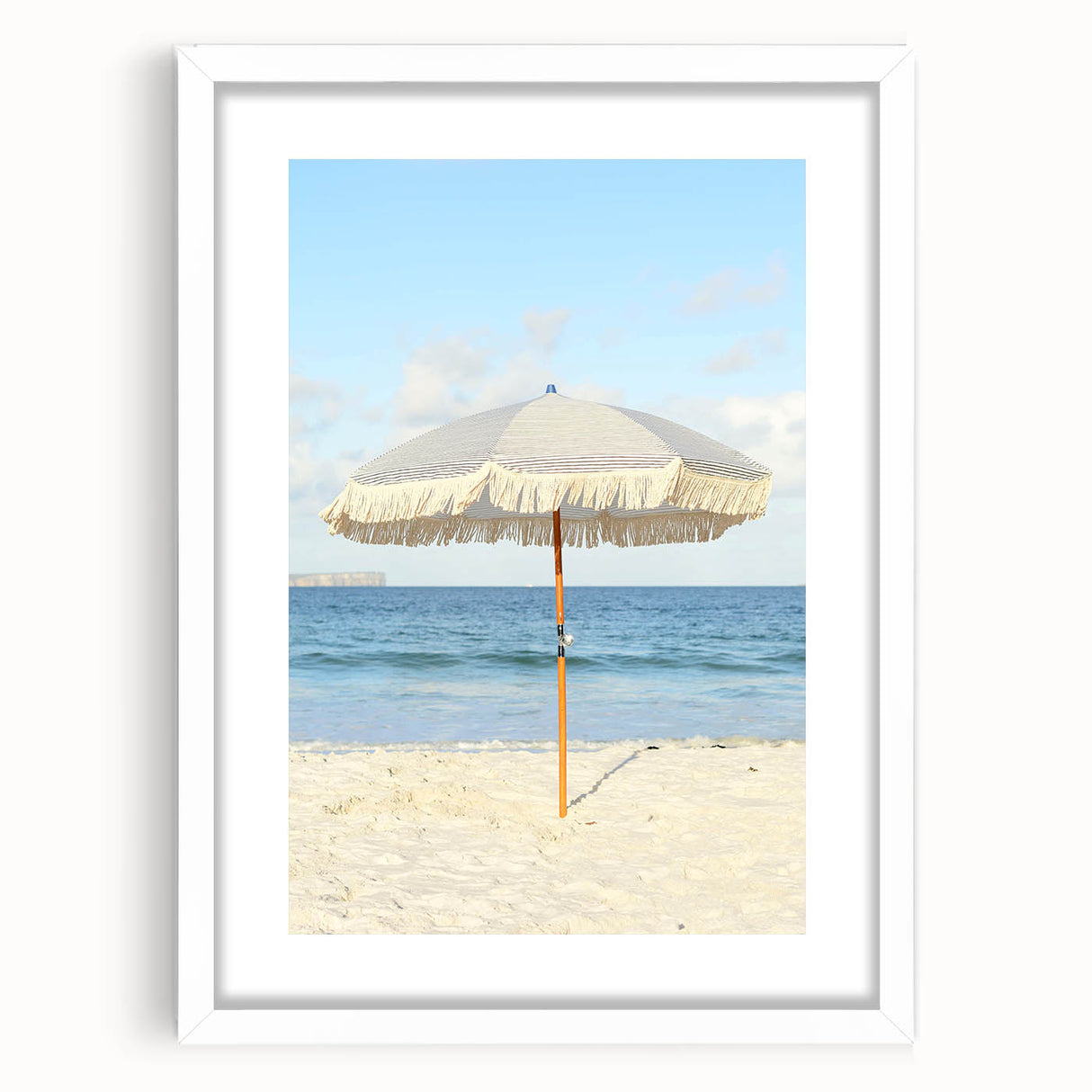 Abstract art print featuring swirling blue and white patterns, framed in white, suitable for dining room decor.