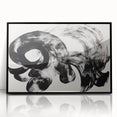 Framed acrylic artwork featuring a modern abstract design with vibrant strokes of black, white, and gray, perfect for contemporary home decor.