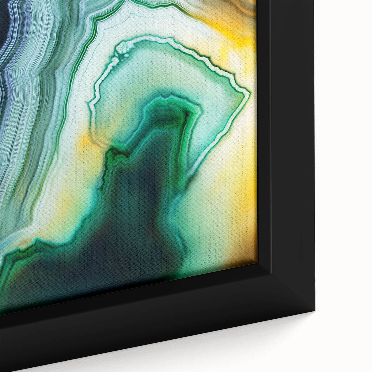 Close-up of a framed canvas showcasing vibrant abstract strokes in shades of blue, orange, and yellow, ideal for modern home decor and art lovers.