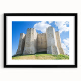 Framed landscape artwork showcasing a picturesque castle scene, elegantly matted in black, ideal for enhancing home decor aesthetics and artistic ambiance.