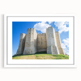 Elegant landscape artwork of a majestic castle framed with a white mat, showcasing intricate details and vibrant colors, perfect for home decor.