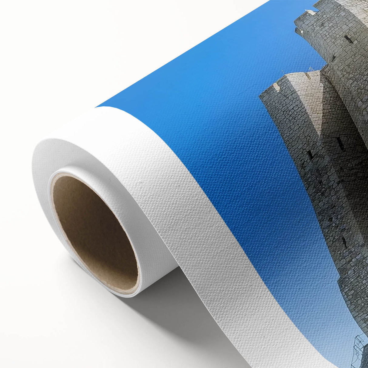 Rolled canvas depicting a picturesque landscape with a majestic castle, showcasing vibrant colors and intricate details, securely packaged in a protective cardboard tube.