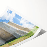 Rolled print showcasing a scenic landscape with a majestic castle set against a vibrant sky, elegantly packaged in a protective cardboard tube for shipping.