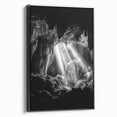 Framed canvas artwork depicting a serene landscape with intricate cave formations, featuring a sleek black frame, ideal for enhancing modern home décor. Perfect for art enthusiasts seeking nature-inspired themes.