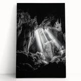 Stretched canvas artwork depicting a serene landscape with caves, featuring earthy tones and dramatic cliffs, perfect for enhancing home decor aesthetics.