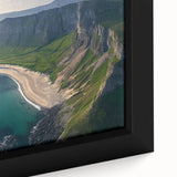 Close-up of a framed canvas artwork depicting dramatic landscapes with towering cliffs and vibrant colors, ideal for enhancing home decor and artistic ambiance.