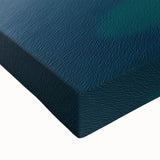 Vibrant close-up of a stretched canvas artwork depicting dramatic cliffs and landscapes, showcasing rich colors and intricate details, perfect for home decor.