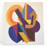 Abstract geometric stretched canvas artwork featuring vibrant blue, orange, and yellow shapes, elegantly leaning against a neutral wall, adding a modern touch to home decor.
