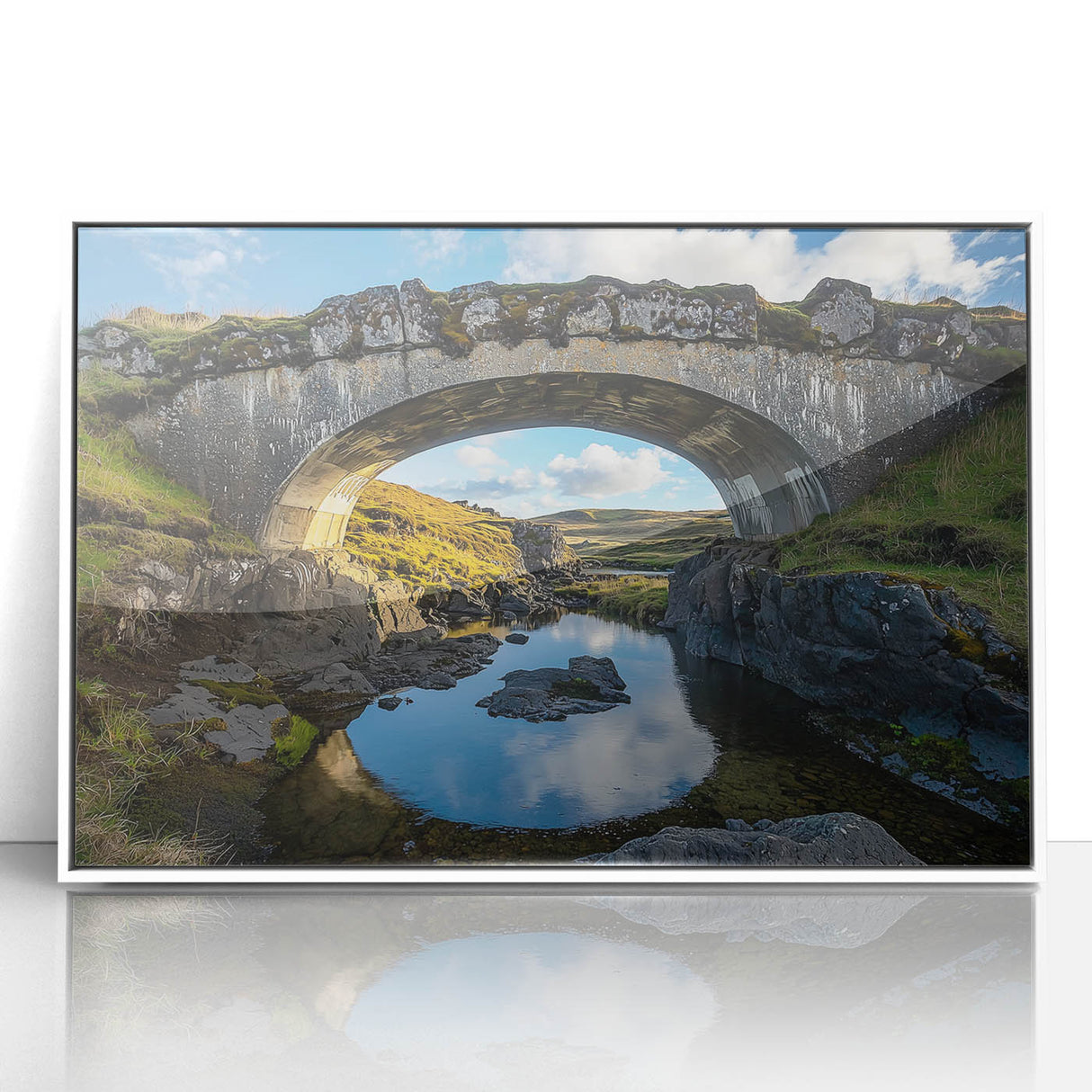 Framed acrylic artwork depicting a serene landscape featuring a modern bridge, with a sleek white frame enhancing the vibrant colors of nature, ideal for home decor.
