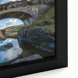 Close-up of a framed landscape canvas featuring a serene bridge scene, with vibrant colors and intricate details, perfect for enhancing home decor aesthetics.