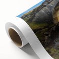 Rolled canvas print showcasing a vibrant landscape bridge design, featuring lush greenery and a serene waterway, packaged securely in a protective cardboard tube. Perfect for home decor enthusiasts looking to add a touch of nature-inspired art to their space.