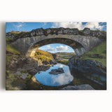 Stretched canvas artwork depicting a serene landscape bridge scene, showcasing vibrant colors and intricate details, perfect for home decor or art collection.