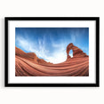 Framed landscape print showcasing a stunning canyon scene with rich earthy tones, matted in black for a modern touch, perfect for home decor.