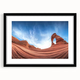 Framed landscape print showcasing a stunning canyon scene with rich earthy tones, matted in black for a modern touch, perfect for home decor.