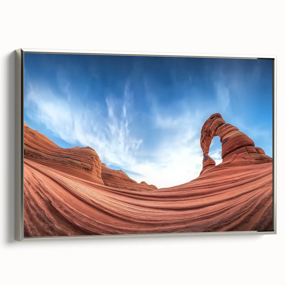 Framed landscape canvas artwork showcasing vibrant canyons with rich colors, complemented by a sleek silver frame, ideal for home decor and nature enthusiasts.