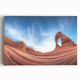 Vibrant landscape canvas artwork depicting colorful canyons under a clear blue sky, expertly stretched for display, ideal for enhancing modern home decor.