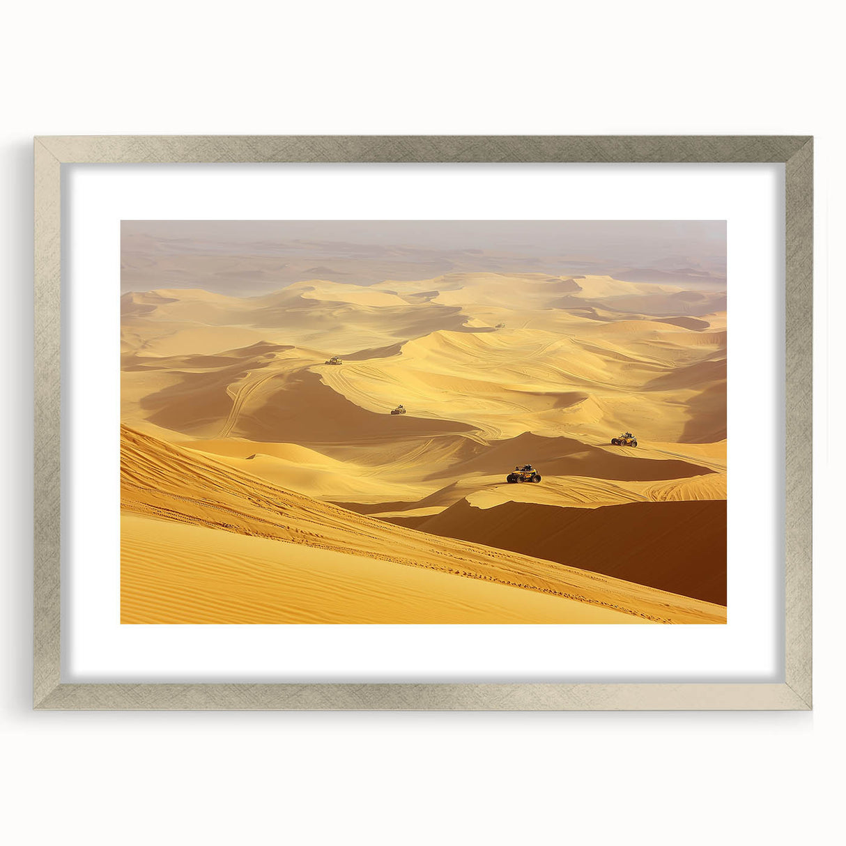 Framed desert landscape artwork featuring a serene sunset with warm tones, encased in a sleek silver frame with a white mat, ideal for home decor.