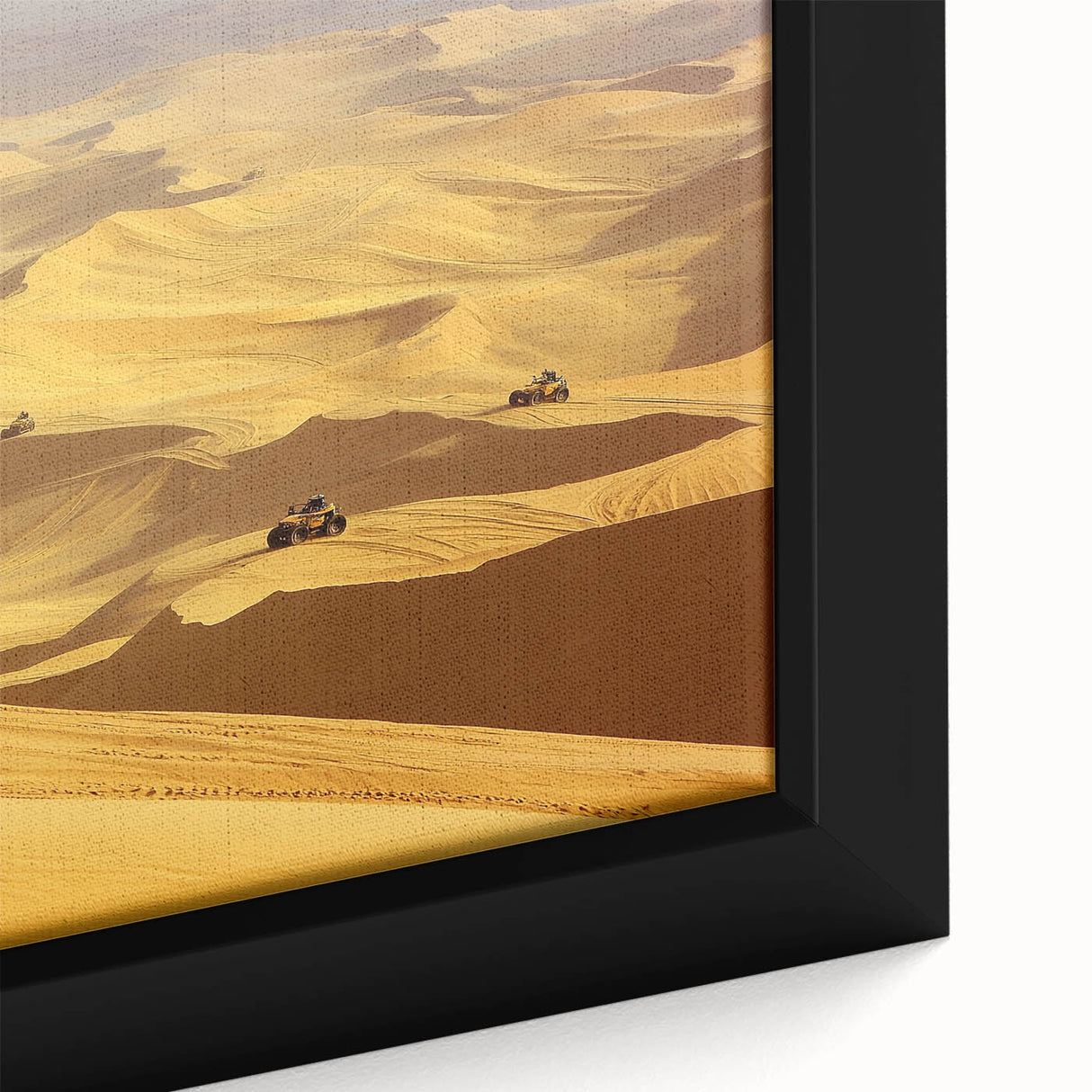 Close-up of a framed canvas artwork depicting a vibrant desert landscape with golden sand dunes under a clear blue sky, showcasing intricate details and textures.