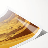 Desert landscape rolled print showcasing vibrant orange and yellow hues, beautifully capturing a sunset over sand dunes, perfect for home decor or art enthusiasts.
