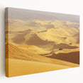 Desert landscape stretched canvas wall art in warm earth tones, showcasing a serene sunset with saguaro cacti silhouettes, perfect for home decor.