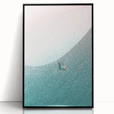 Large abstract wall art featuring swirling blue and white patterns on a black acrylic print.