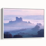 Framed canvas artwork depicting a picturesque landscape with a castle, showcasing vibrant colors and intricate details, set against a white background for a modern touch.