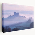Stretched canvas artwork depicting a serene landscape with a majestic castle surrounded by lush greenery and vibrant blue skies, perfect for home decor.