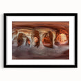 Framed landscape artwork depicting a serene cave scene, featuring a black mat border and sleek black frame, ideal for enhancing home decor aesthetics.