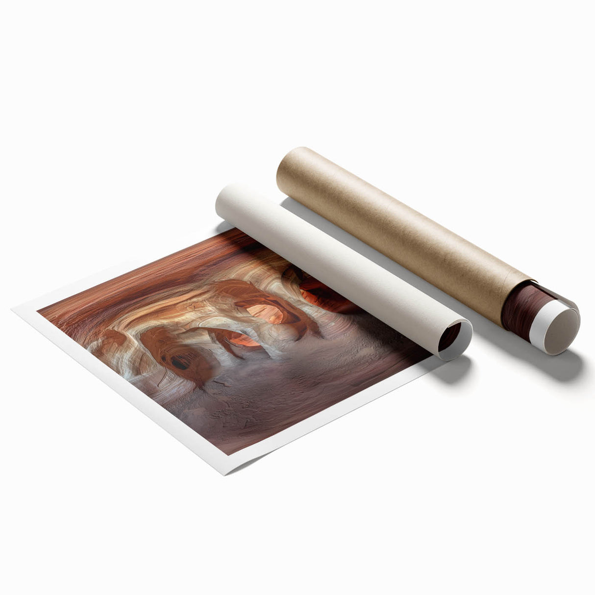 A rolled print showcasing a stunning landscape of caves with intricate details and vibrant colors, elegantly packaged in a protective cardboard tube for safe delivery.