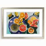 Textured abstract art print of assorted fruits in muted earth tones, framed in silver, ideal for kitchen decor.