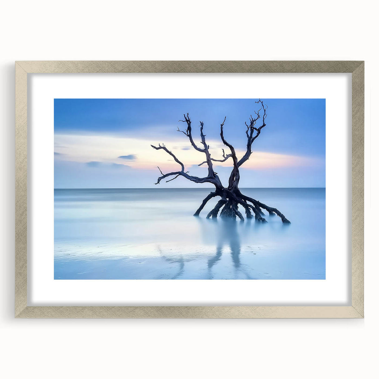 Landscape artwork featuring serene beach scene framed in a silver mat, showcasing soft sand and gentle waves, perfect for coastal decor enthusiasts.