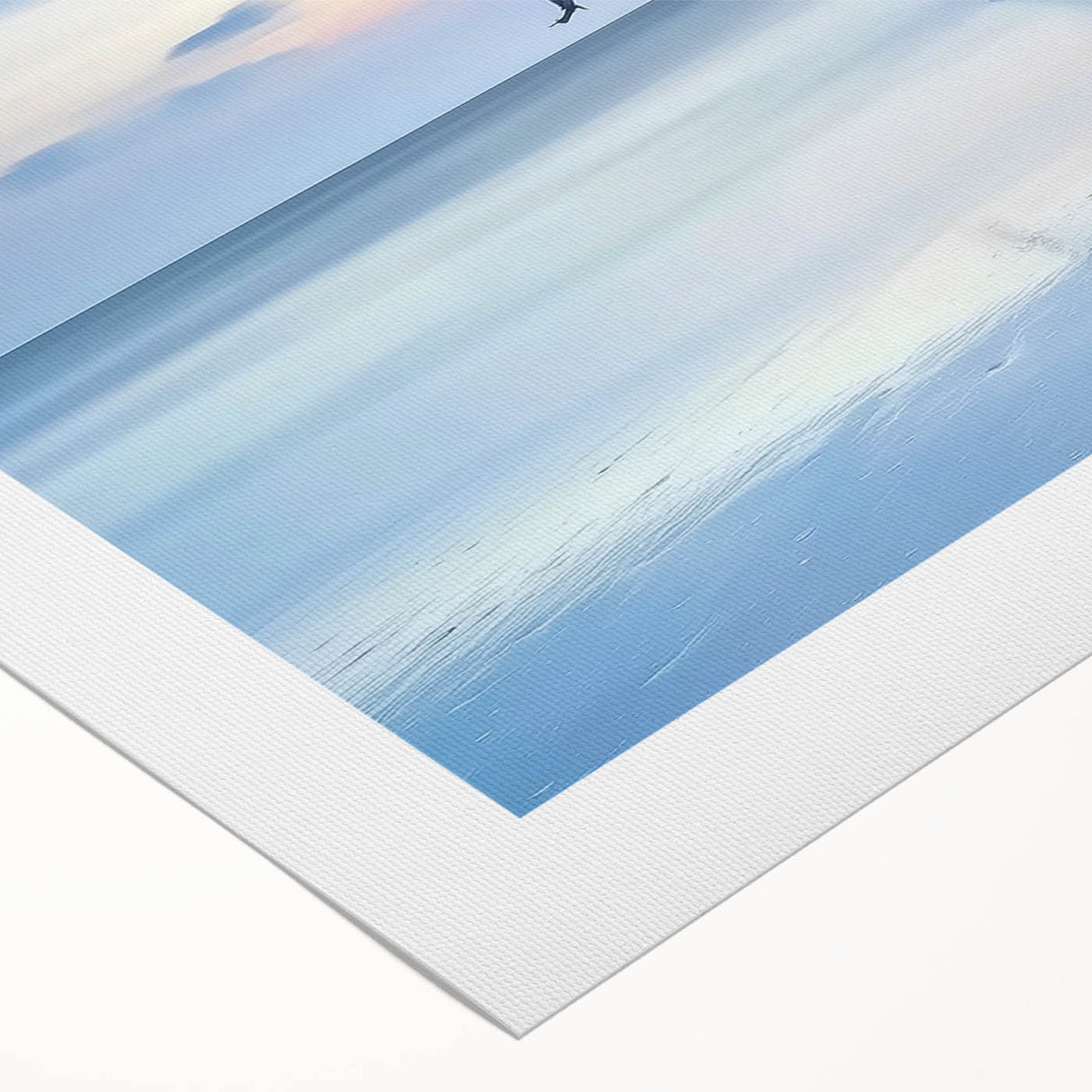 Vibrant rolled canvas artwork showcasing a serene beach landscape with soft blue skies and gentle waves, elegantly packaged in a protective cardboard tube.