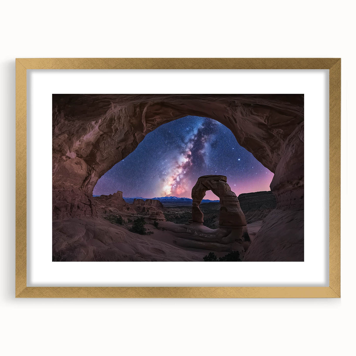 Golden-framed landscape artwork depicting vibrant canyons, elegantly matted for a polished finish, perfect for enhancing home decor aesthetics.