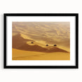 Black-framed landscape artwork showcasing a serene desert scene with vibrant colors and intricate details, perfect for home decor or office spaces.