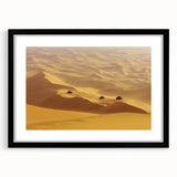 Black-framed landscape artwork showcasing a serene desert scene with vibrant colors and intricate details, perfect for home decor or office spaces.