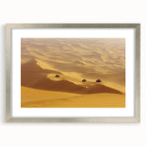 Silver-framed landscape art depicting a serene desert scene with vibrant colors, elegantly matted for a polished presentation, ideal for home decor.