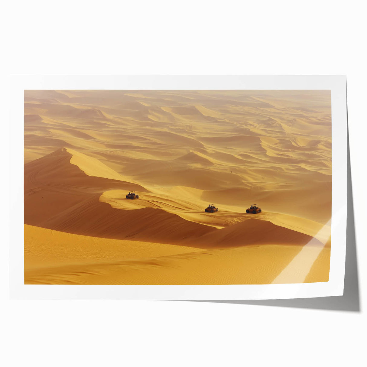 Desert landscape rolled canvas print showcasing vibrant, warm hues of orange and yellow sand dunes under a clear blue sky, elegantly packaged for art enthusiasts.