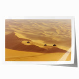 Desert landscape rolled canvas print showcasing vibrant, warm hues of orange and yellow sand dunes under a clear blue sky, elegantly packaged for art enthusiasts.