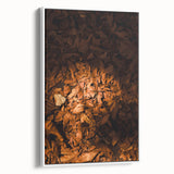 Vintage poster art featuring a fall landscape in vibrant orange and red tones on a large framed canvas.