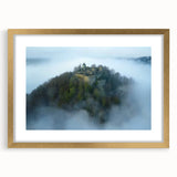 Elegant gold-framed landscape print showcasing a stunning castle scene, complete with a white mat, ideal for enhancing home decor and adding a touch of sophistication.