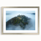 Elegant silver-framed landscape artwork showcasing a majestic castle scene with intricate details and a white mat, perfect for enhancing home decor.