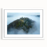 Elegant white-framed landscape artwork showcasing a majestic castle surrounded by lush greenery and a tranquil sky, perfect for home decor enhancement.