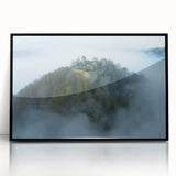 Framed acrylic artwork showcasing a picturesque landscape with a majestic castle, displayed in a sleek black frame, ideal for home decor and art enthusiasts.