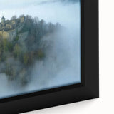 Close-up of a framed canvas artwork depicting a serene landscape with a majestic castle, vibrant colors, and intricate details, perfect for home decor.