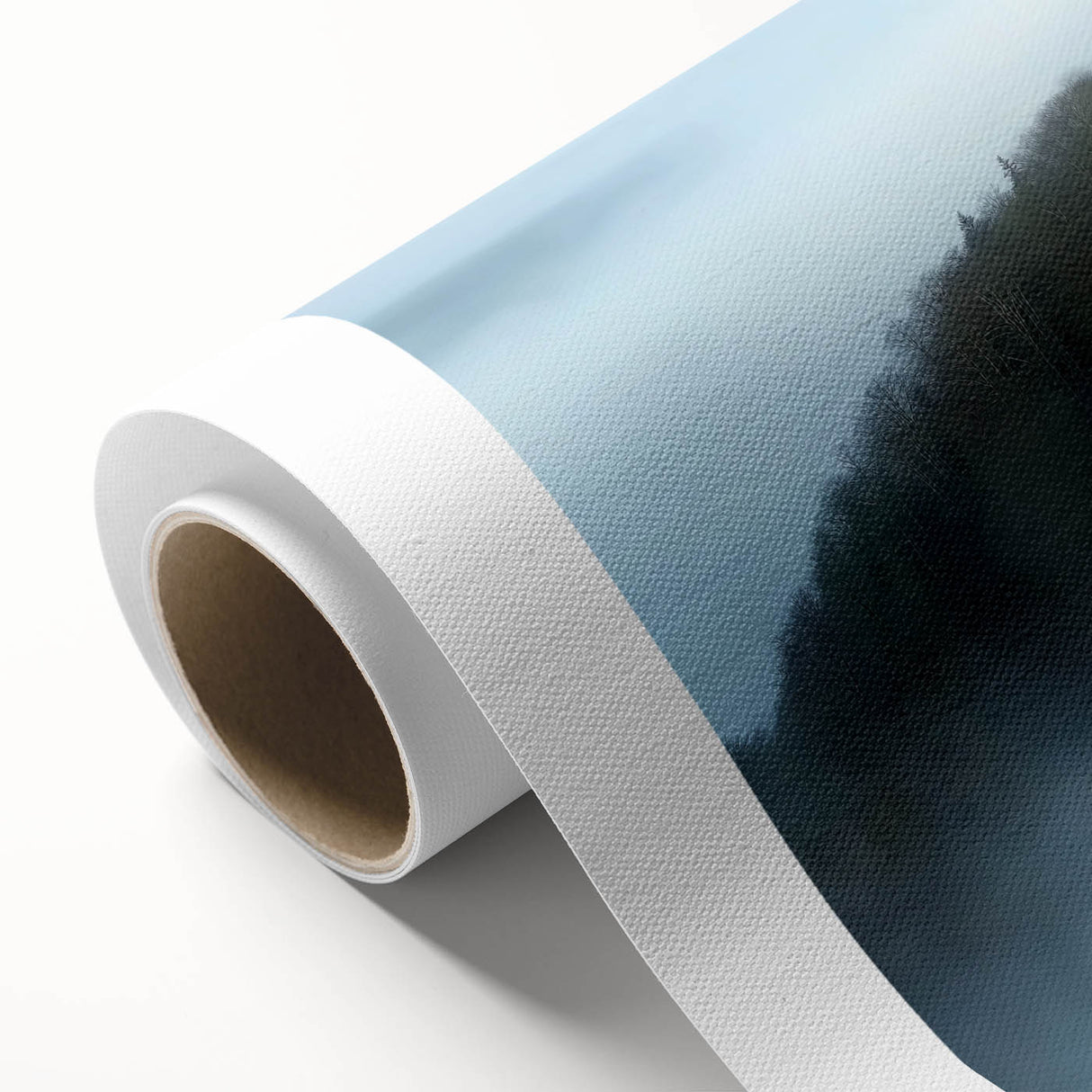 Rolled canvas artwork showcasing a picturesque landscape with a medieval castle surrounded by lush greenery, packaged securely in a protective cardboard tube for delivery.